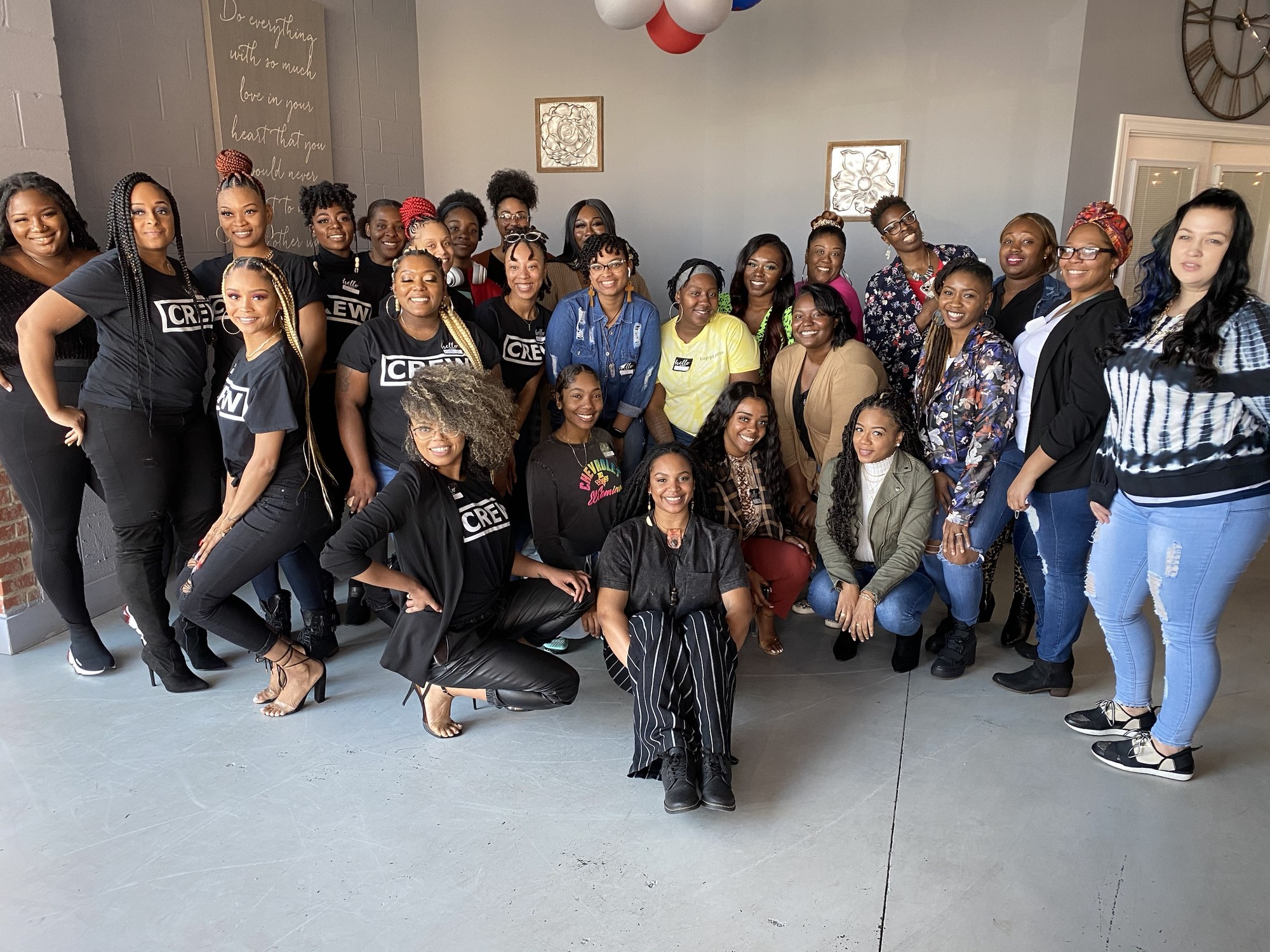 Braiders and educators posing together at a Braiders Only workshop